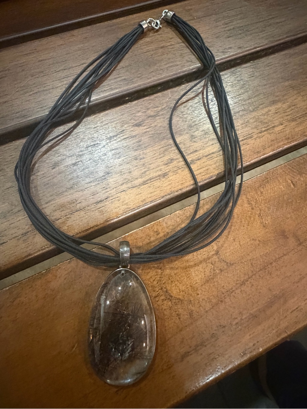 Black Multi-Strand Necklace With Clear Teardrop Pendant